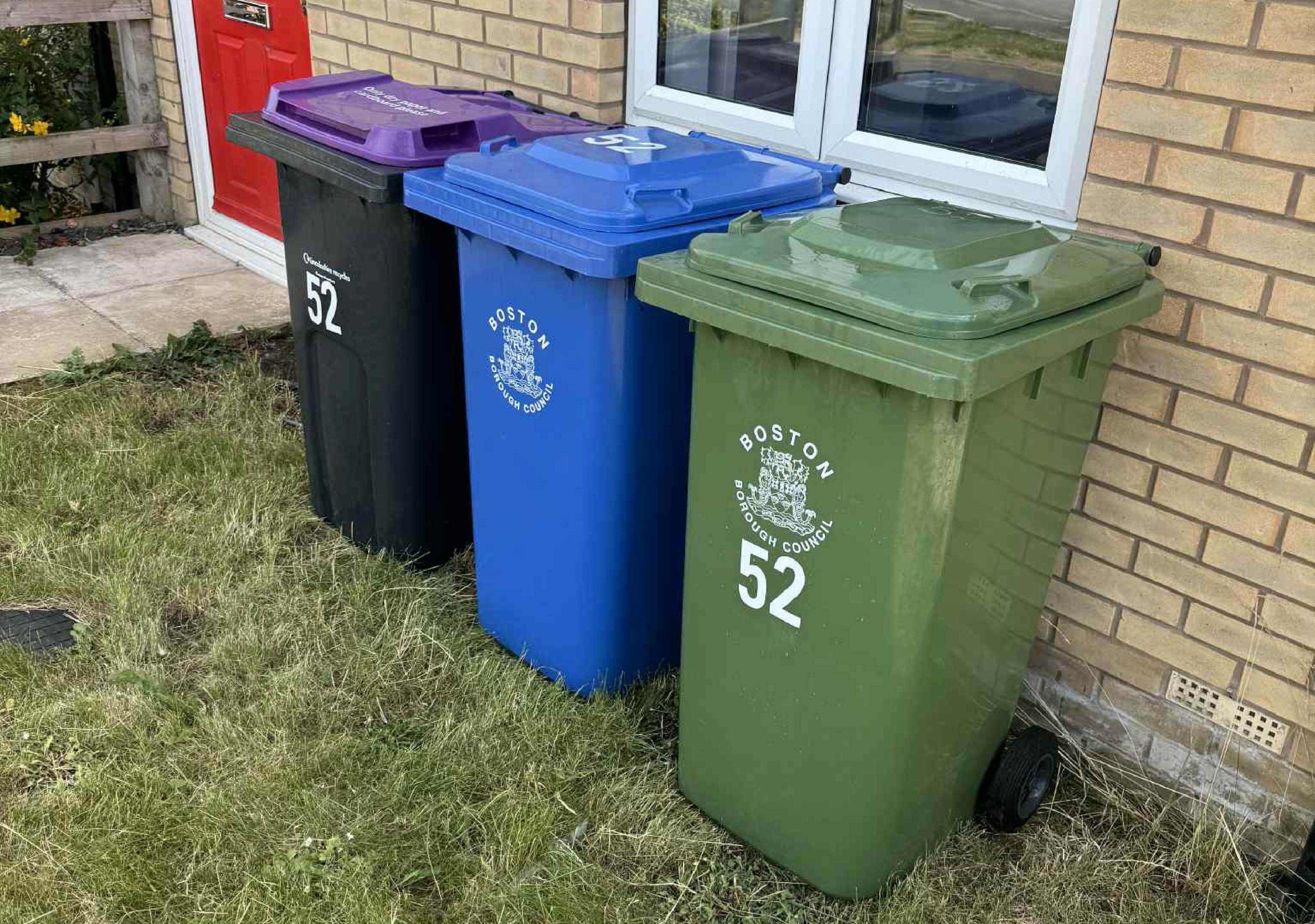 an image of multicoloured wheelie bins